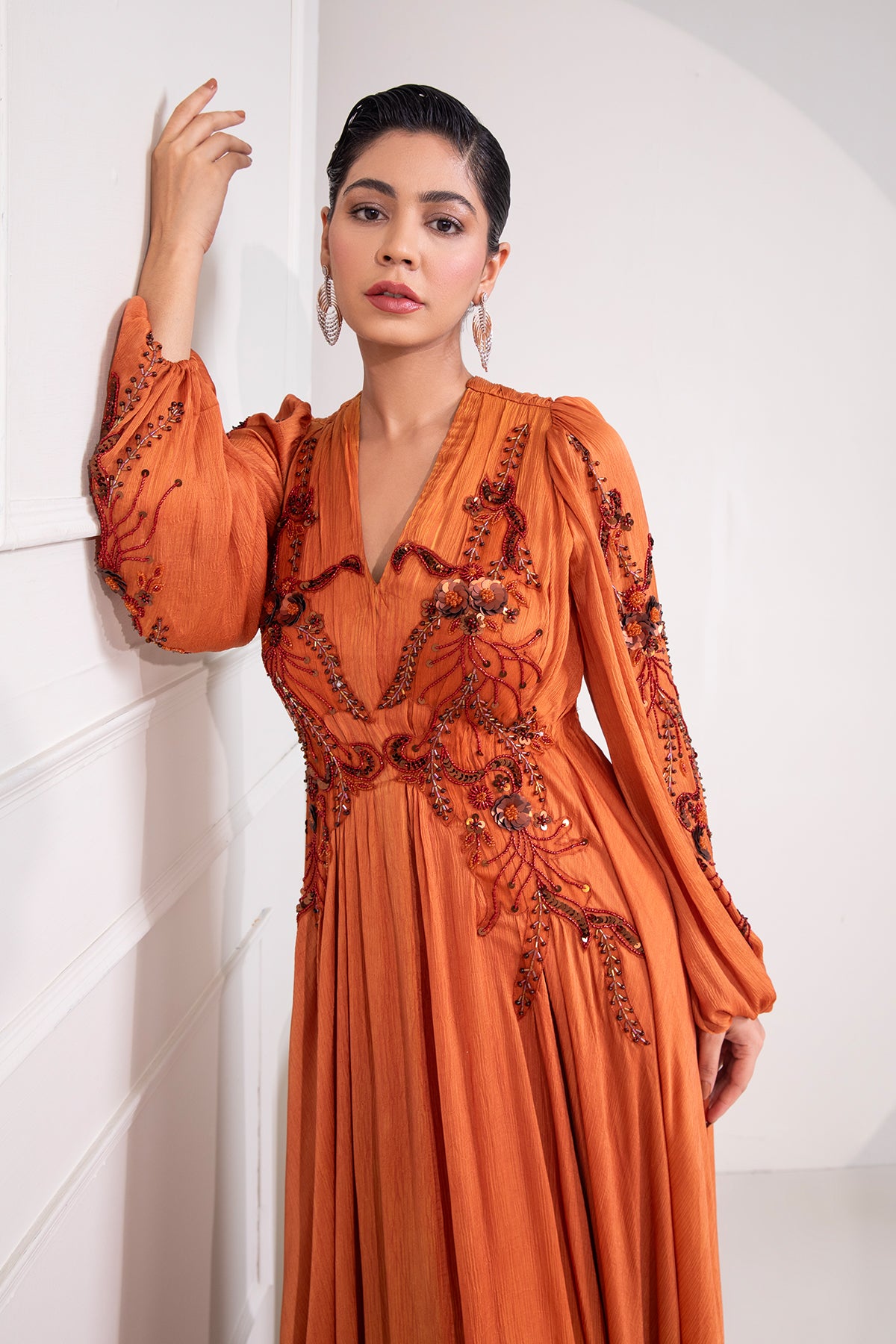 Brunt Orange draped flare gown with intricate tonal embroidery