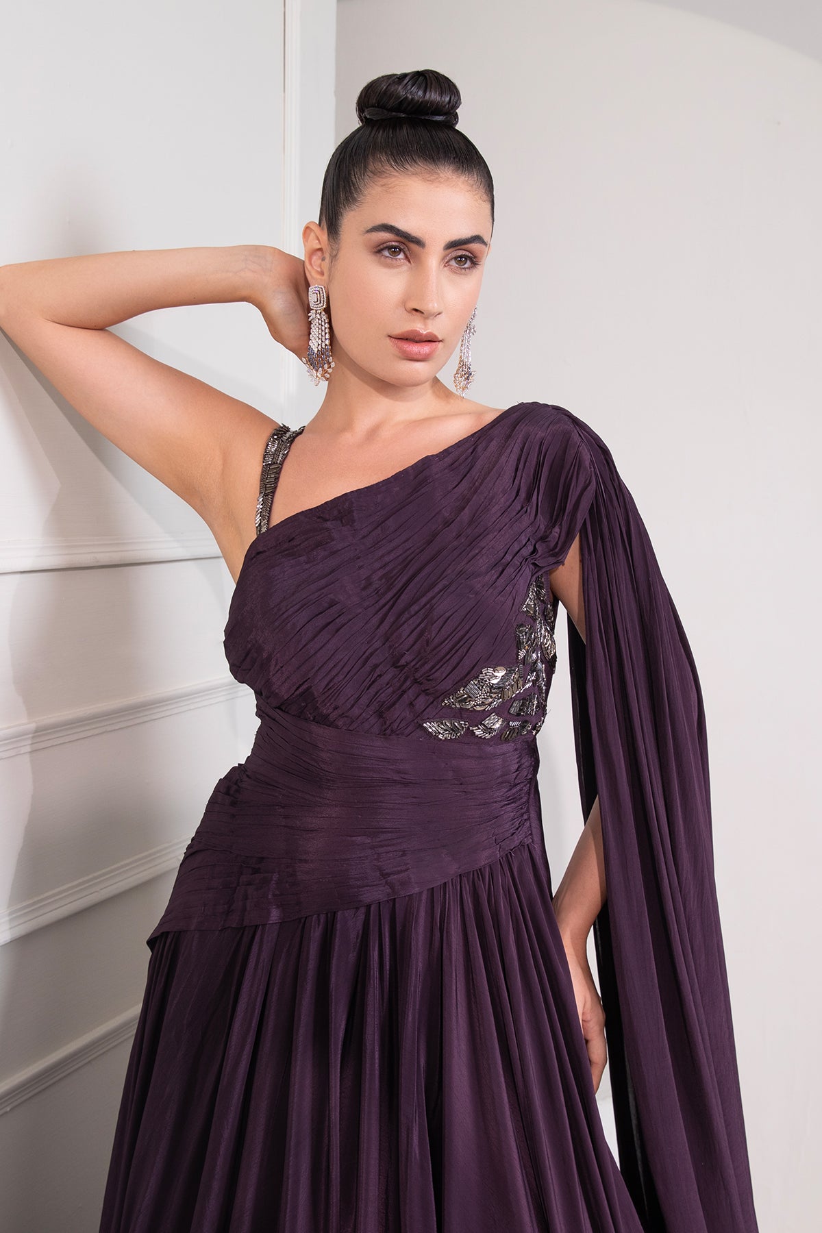 Midnight plum draped cutdana flared gown