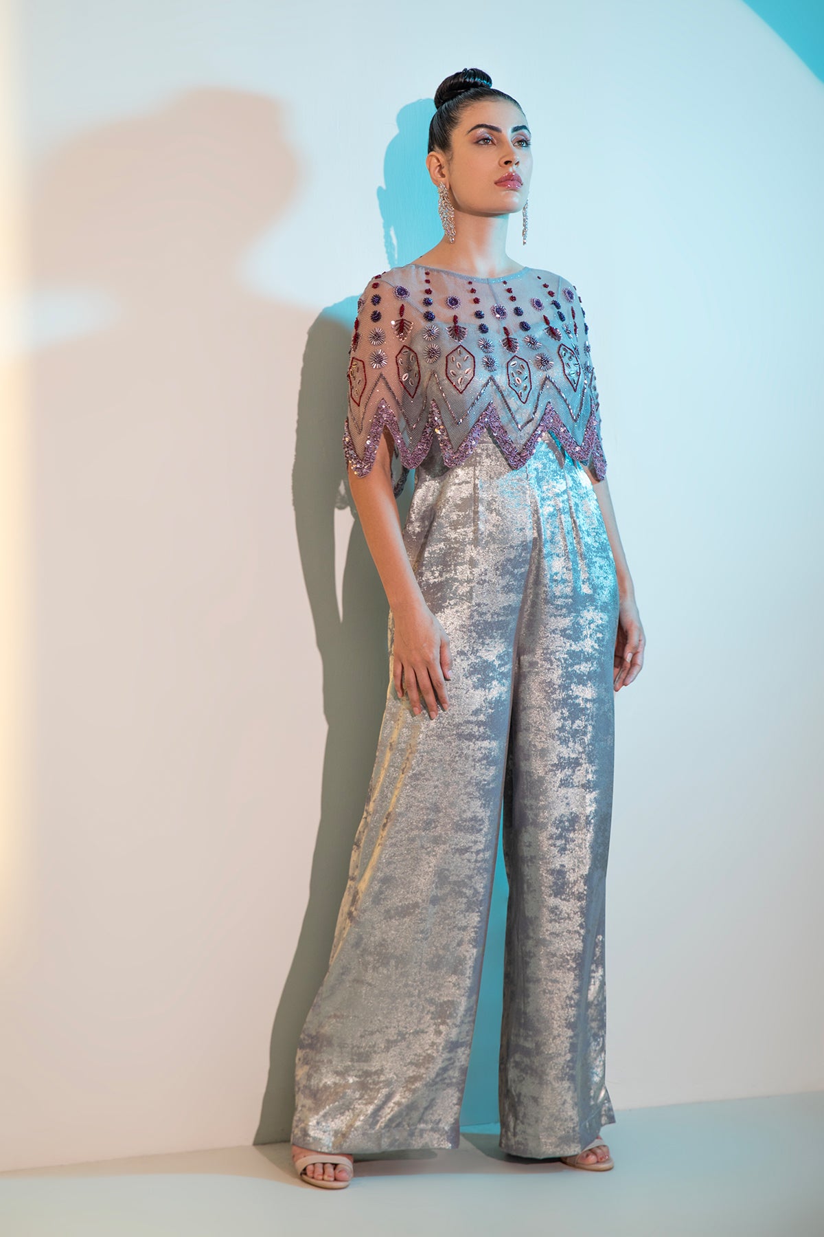 Grey Metallica jumpsuit with embellished cape