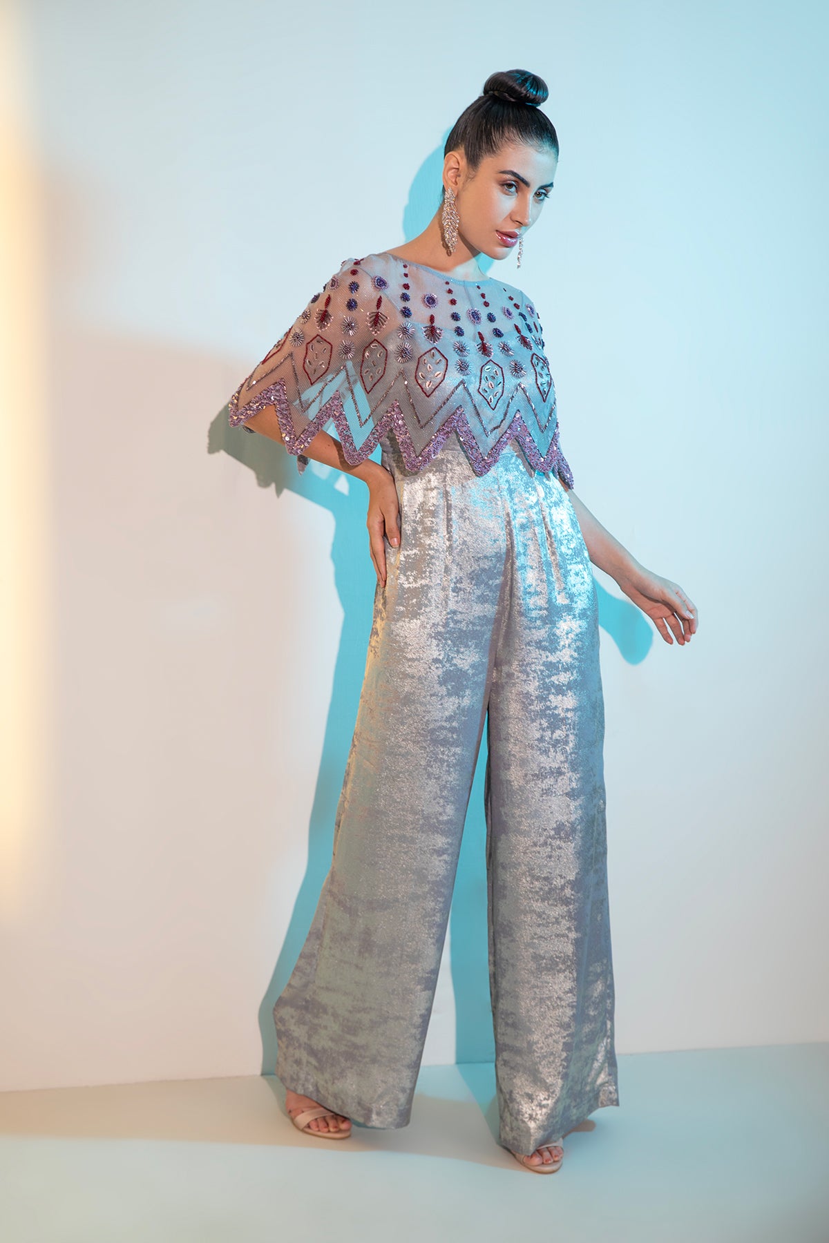 Grey Metallica jumpsuit with embellished cape