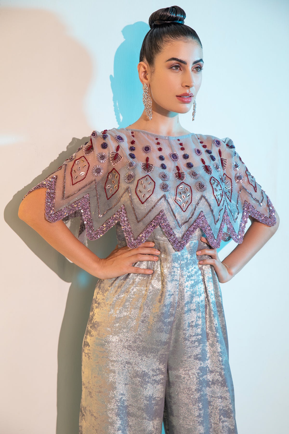 Grey Metallica jumpsuit with embellished cape