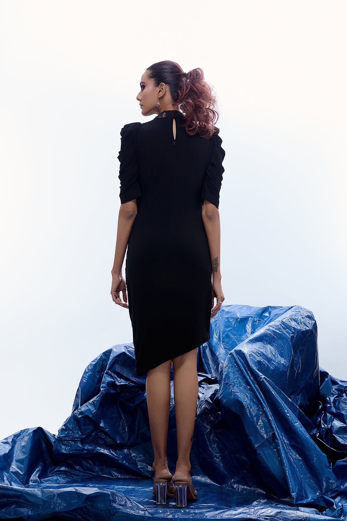 ASYMMETRIC COWL DRESS WITH STATEMENT EMBELLISHMENT