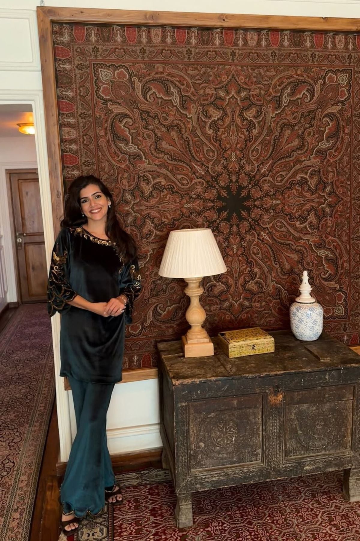 Bottle green velvet keyhole kurti with Baroque motif work, paired with scalloped trousers detailed on neckline, sleeves, and hem Shop Now!