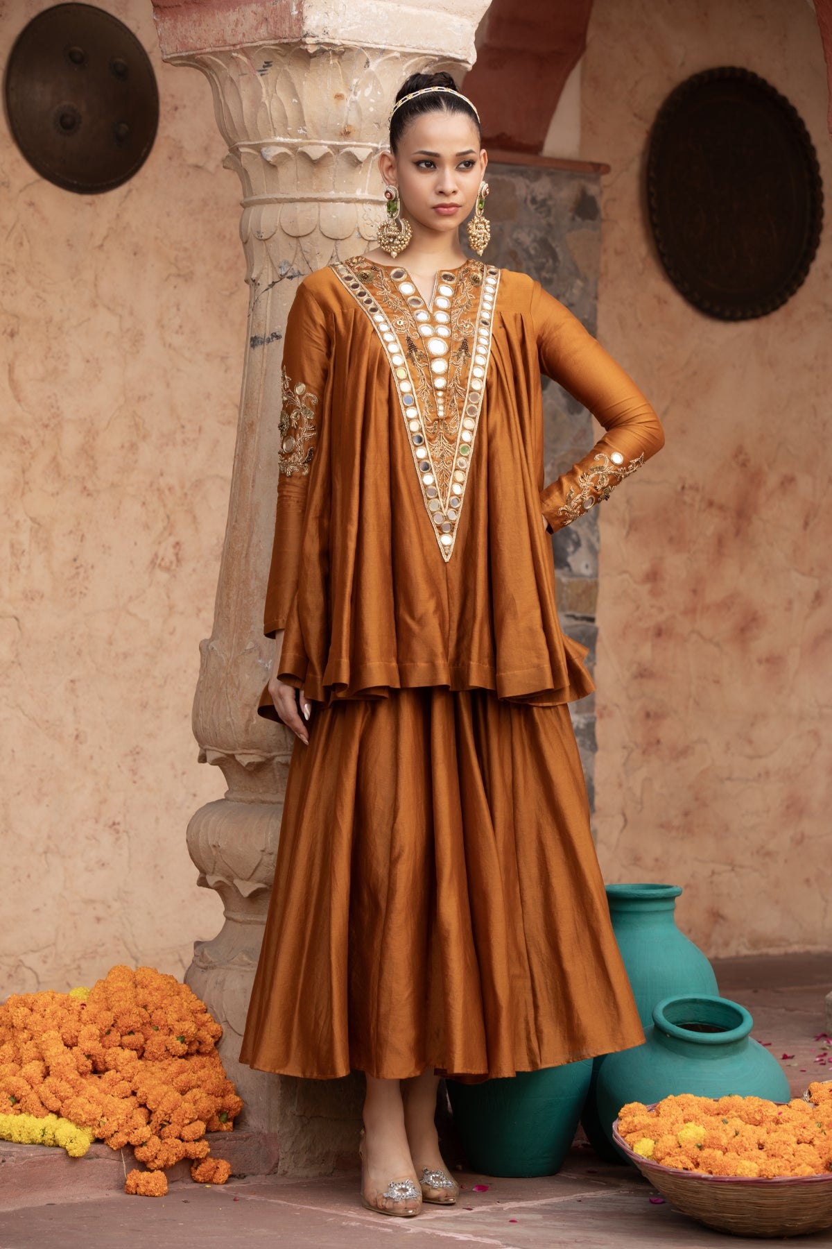 ure Chanderi silk kalidaar tunic with midi lehenga, intricately hand-embellished with zari and mirror work. Shop Now!
