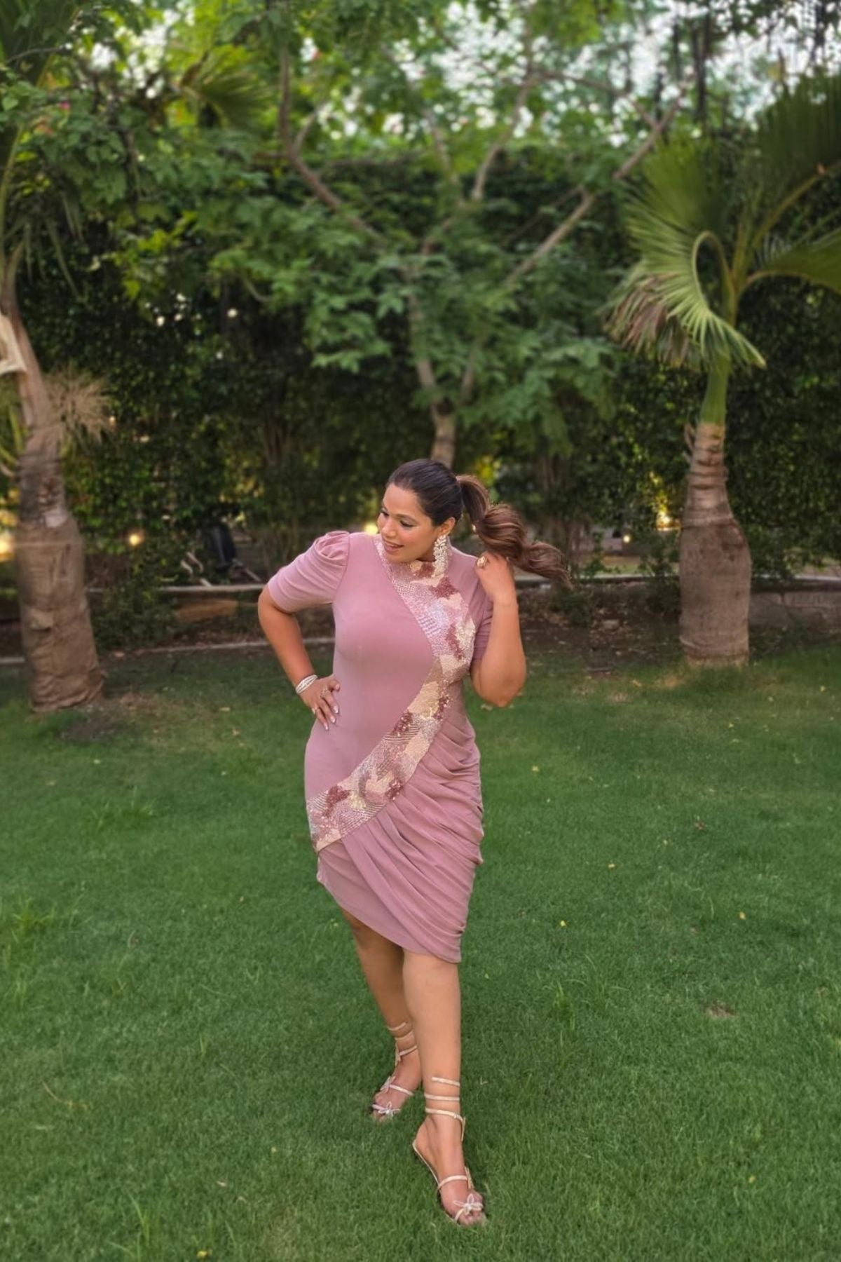 The dress is designed with a flattering form fitting bodycon include soft draping slightly stretchyhigh neck collar and structured puff sleeves shimmering multi tone sequins that flow from neckline to down across. Shop Now!