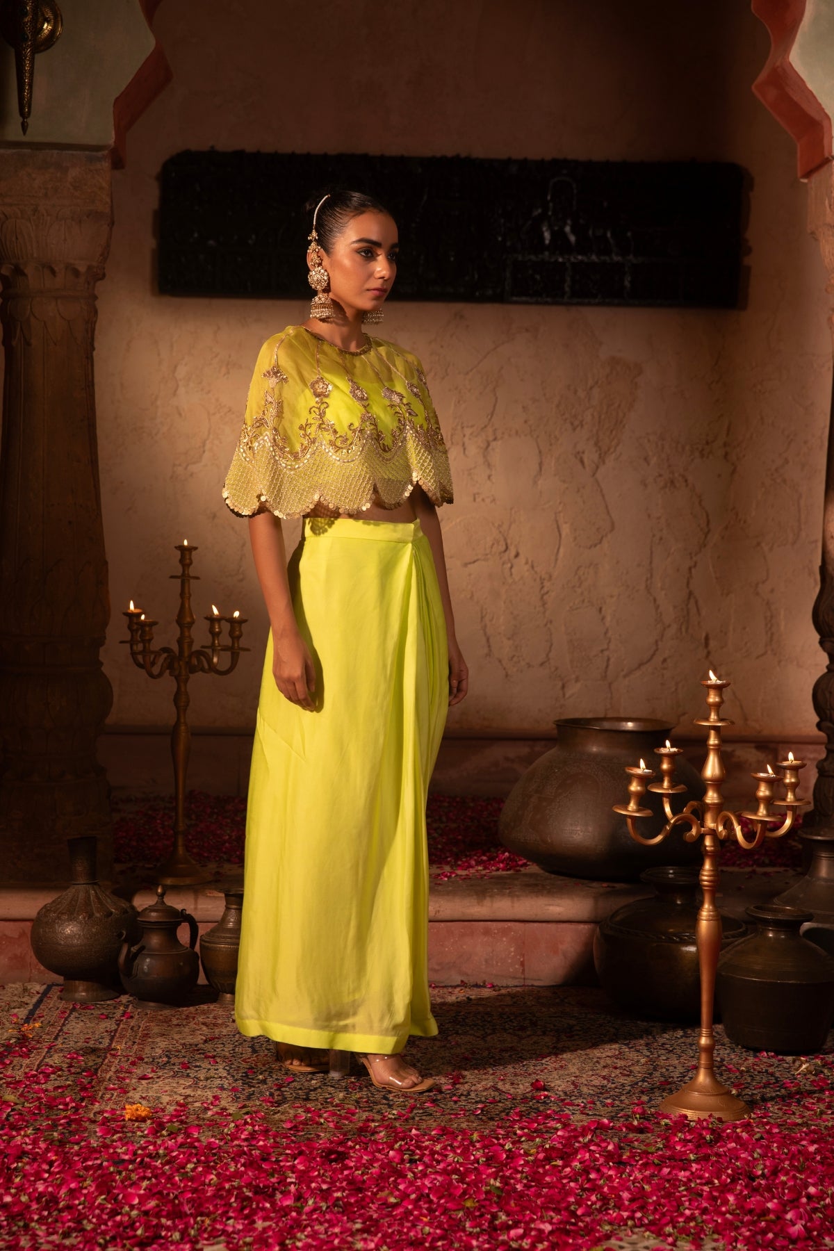 Lime organza satin draped skirt and crop top with scalloped organza cape, intricately hand-embellished in Rococo motifs. Shop Now!