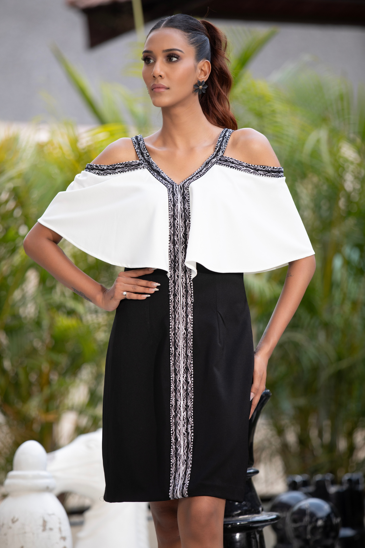 Structured bodycon sheath dress with knee length hemline intricate contrast geometrical hemline Shop Now!