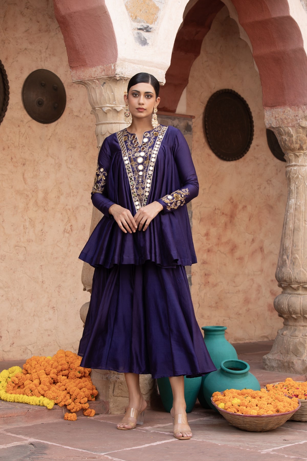 Pure Chanderi silk full-sleeve kalidaar tunic with midi lehenga, intricately hand-embellished with zari and mirror work. Shop Now!
