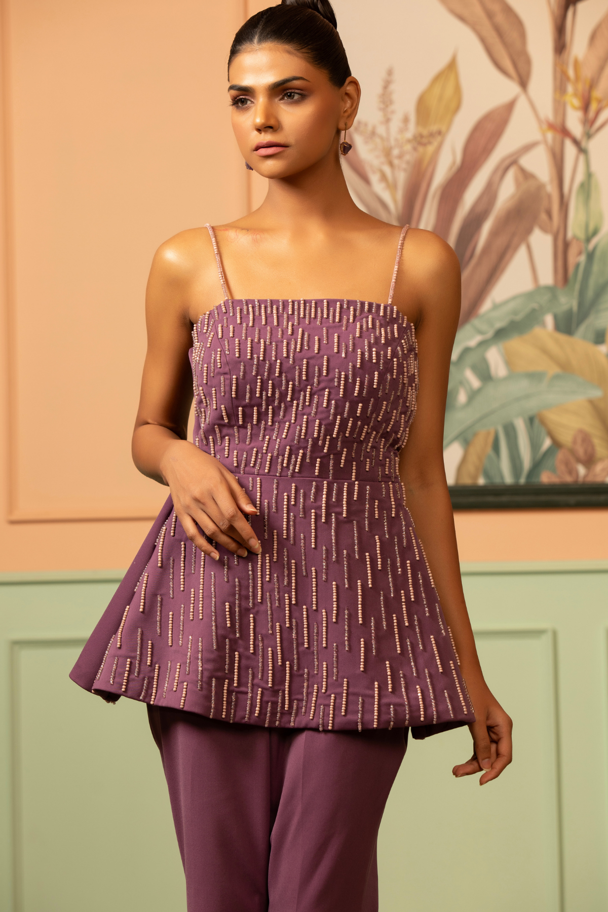 Two piece purple coord set offer a contemporary fusion look strappy neckline structured peplum geometric embroidery paired with matching solid tone wide leg palazzo pant Shop Now!
