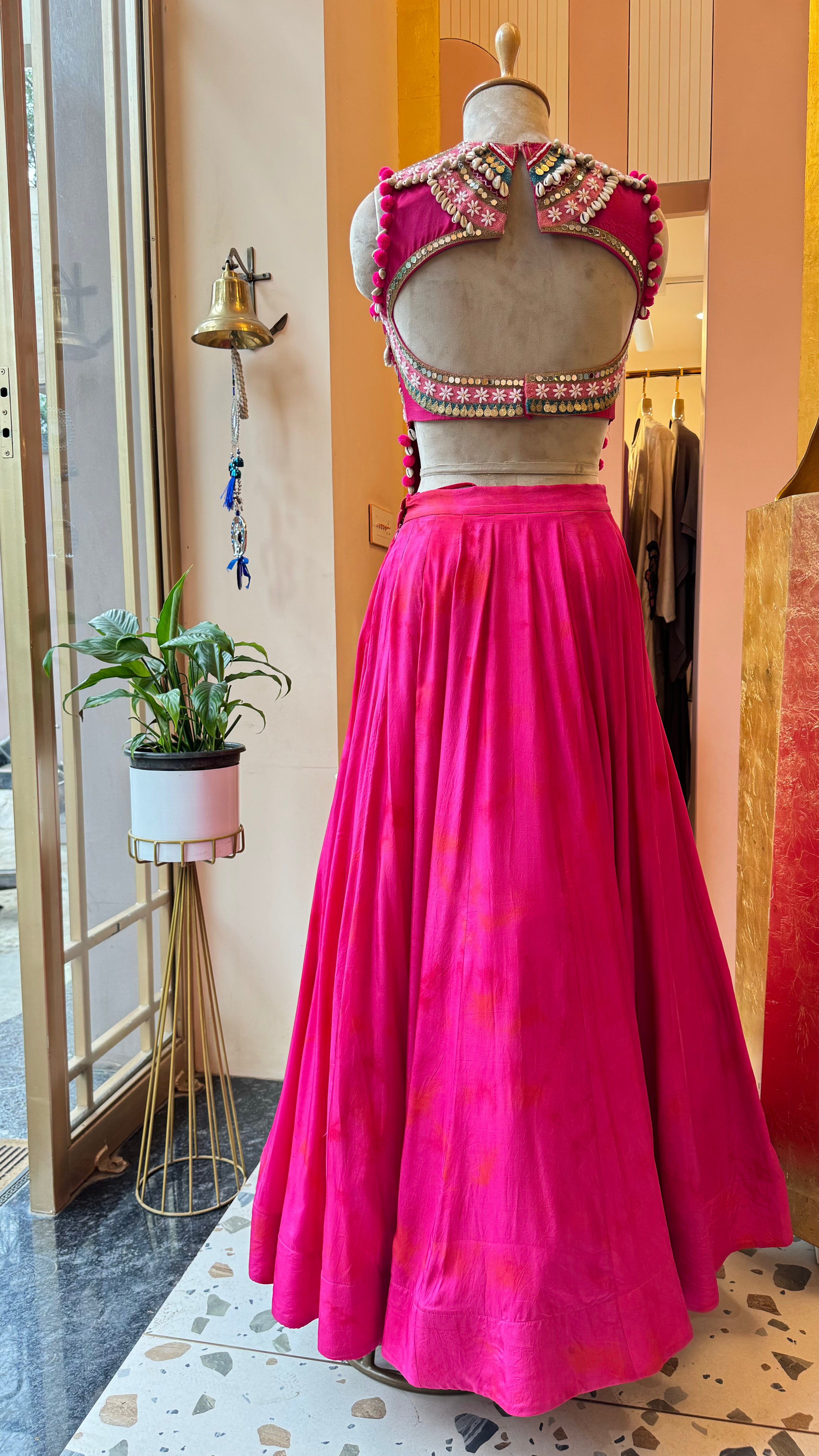 2 Cinnamon Rolls in Rani Pink Tie dye Croptop-Lehenga Set. Shop Now!