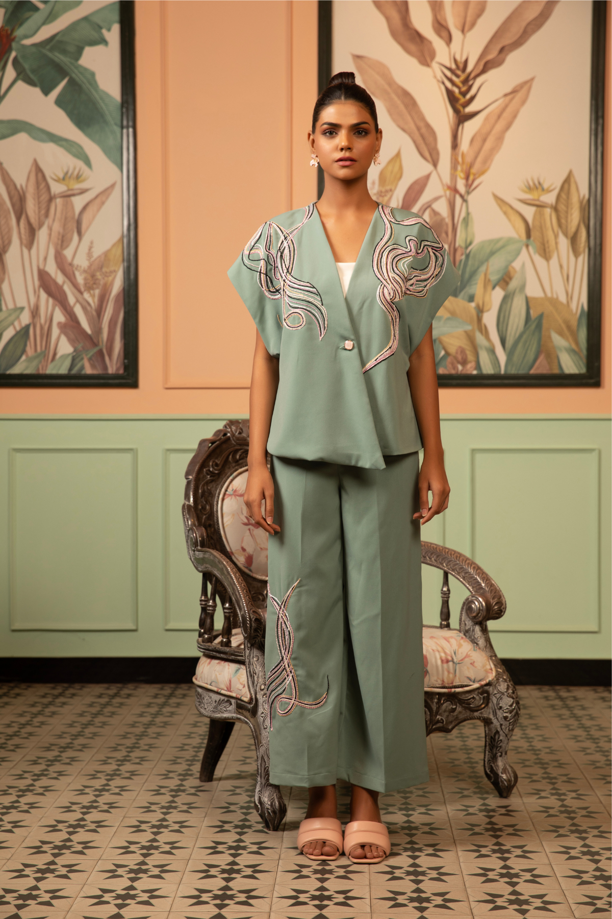 This sage green co-ord set features a contemporary indo western intricate white hand embroidery and thread detailing on both top and bottom Shop Now!