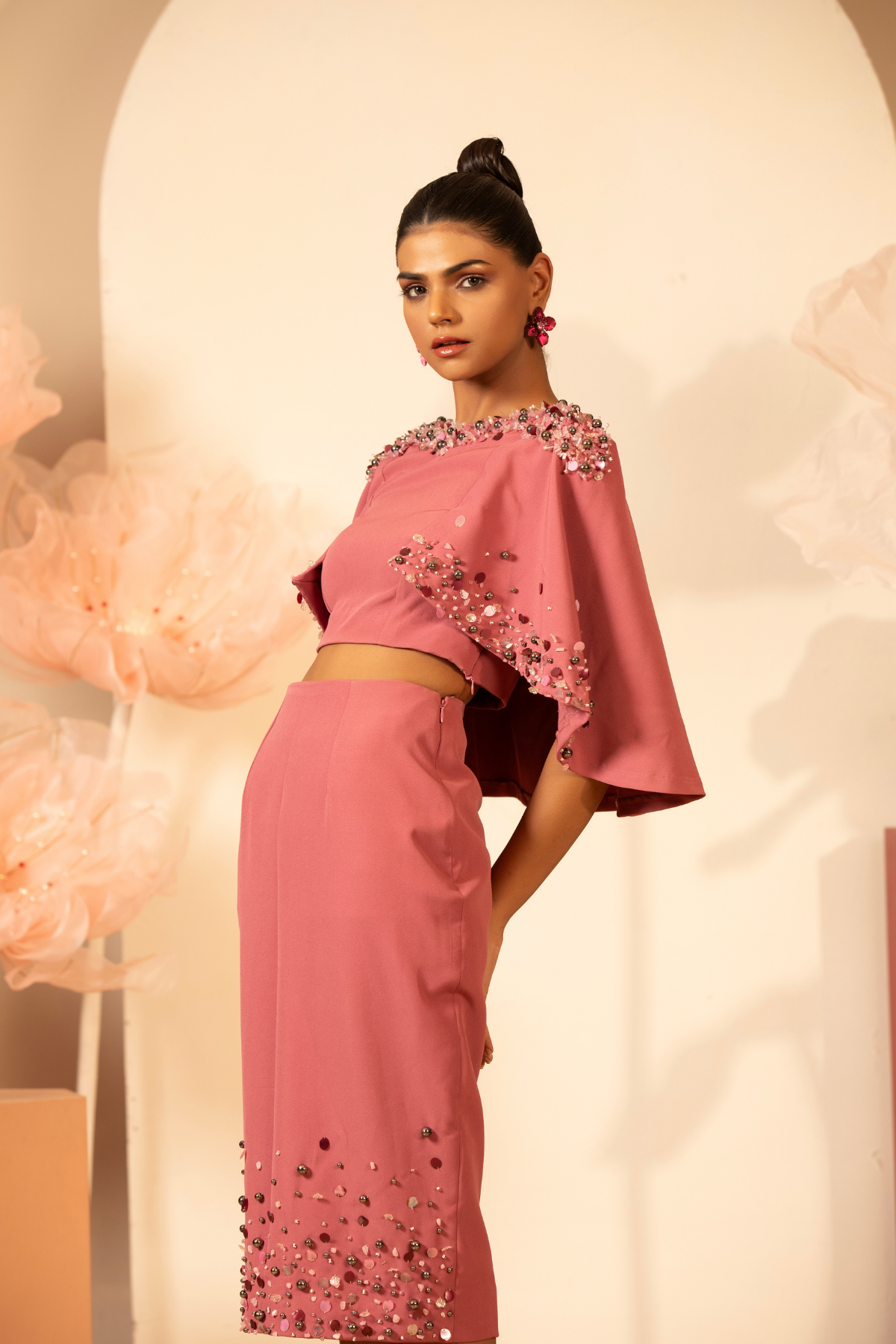 The off the shoulder dress which delicate three dimentional floral applique and flower motif with light handed detailing sequins and bead.Fit and flare falls to a mid calf length Shop Now!