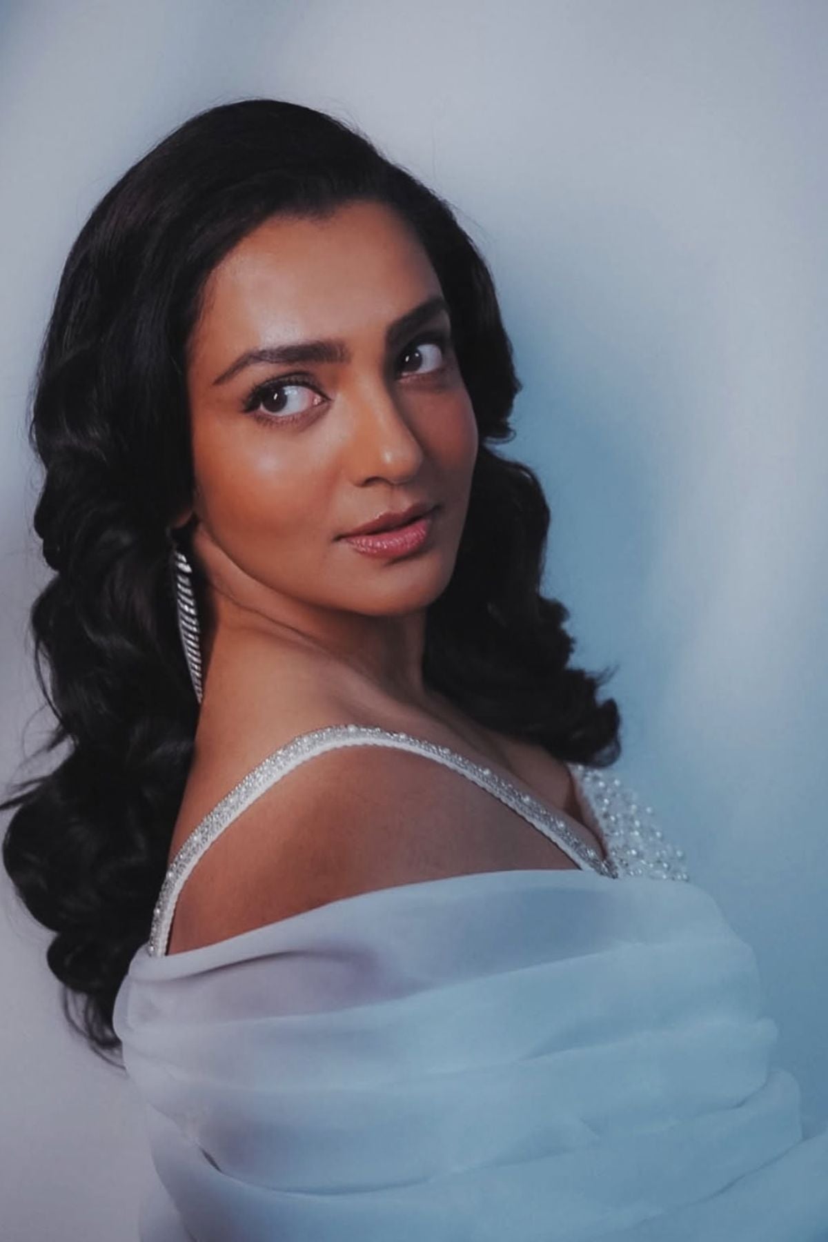 This midi gown that seamlessly balance classic tailoring with experimental draping with asymmetrical neckline with intricate embellishments Shop Now!