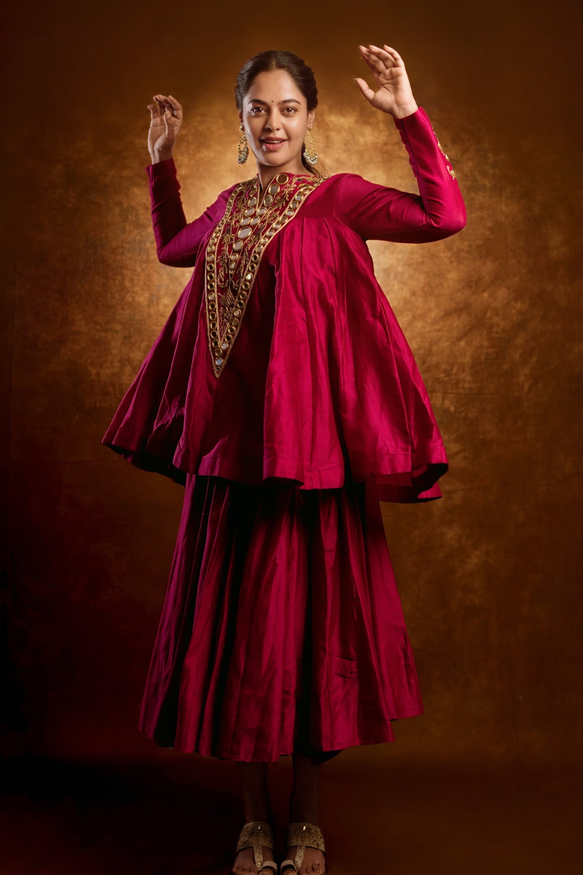 Pure Chanderi silk full-sleeve kalidaar tunic with midi lehenga, hand-embellished with zari and mirror work. Shop Now!