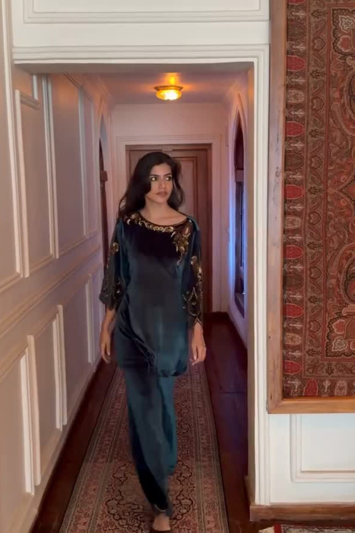 Bottle green velvet keyhole kurti with Baroque motif work, paired with scalloped trousers detailed on neckline, sleeves, and hem Shop Now!