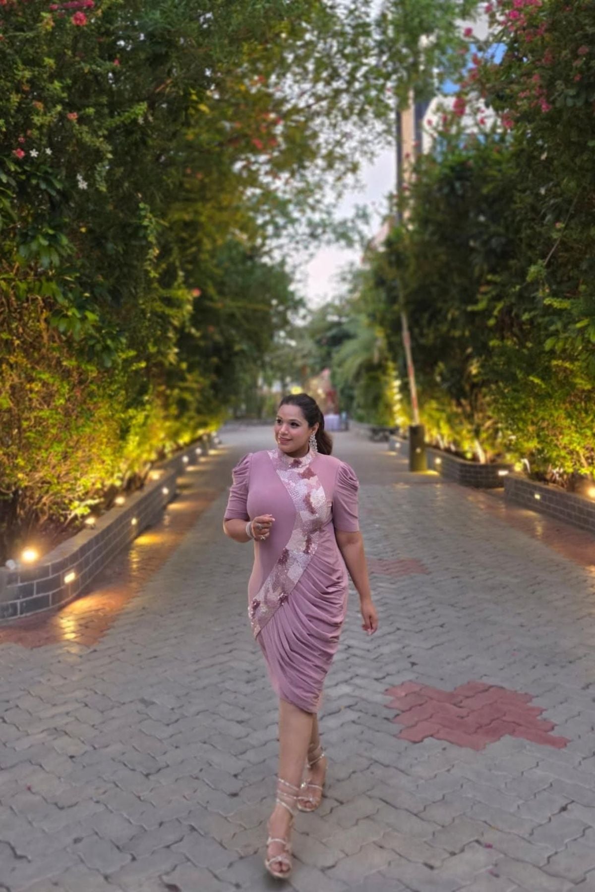 The dress is designed with a flattering&nbsp;form fitting bodycon include soft draping&nbsp;slightly stretchyhigh neck collar and structured&nbsp;puff sleeves shimmering multi tone sequins&nbsp;that flow from neckline to down across. Shop Now!