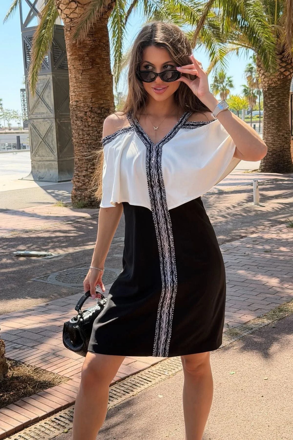 Structured bodycon sheath dress&nbsp;with knee length hemline intricate&nbsp;contrast geometrical hemline. Shop Now!