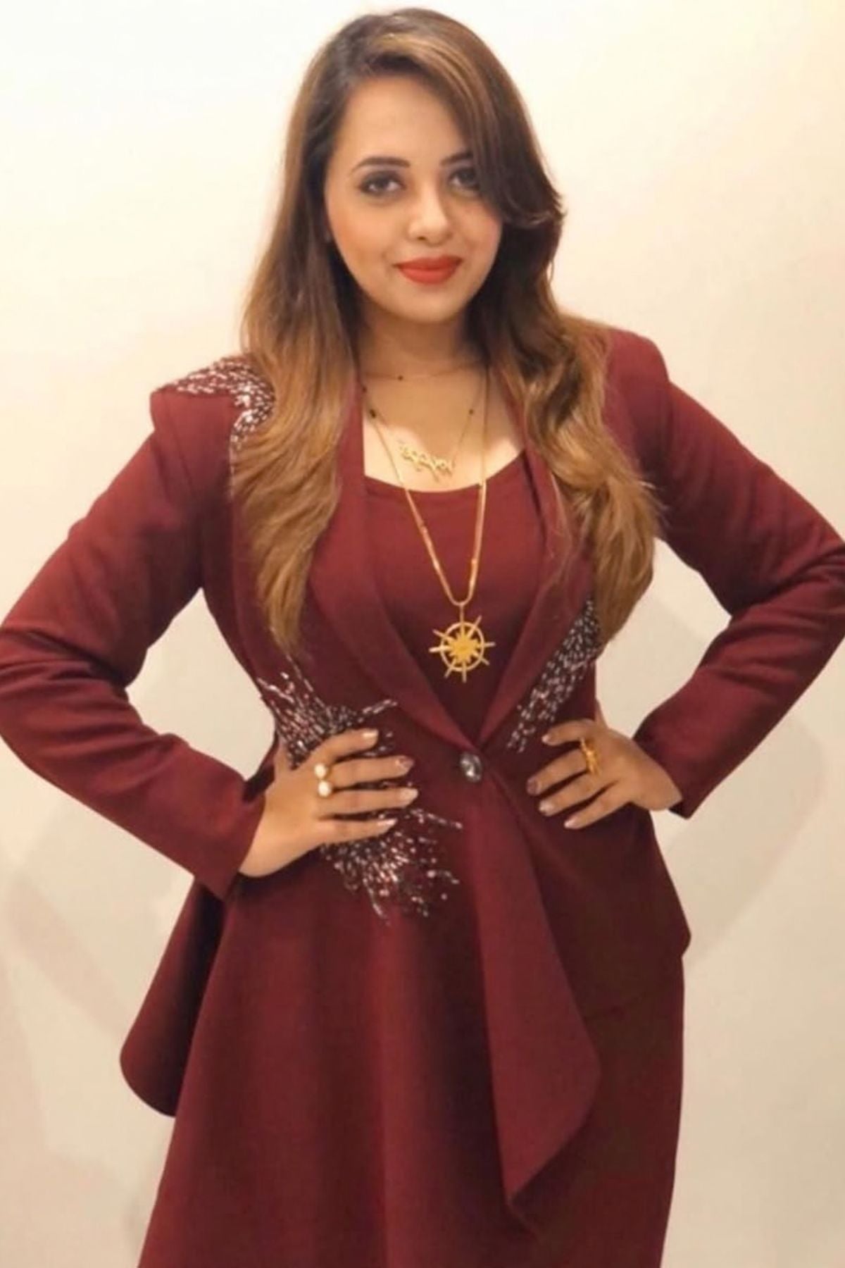 Tailored to sartorial perfection this single-breasted roll collar, peplum style blazer is paired with classic trousers. Its artistic intricate hand-embroidery with a mix of pipes, beads, sequin,cutdana, etc reflects aesthetic craftsmanship . Shop Now!