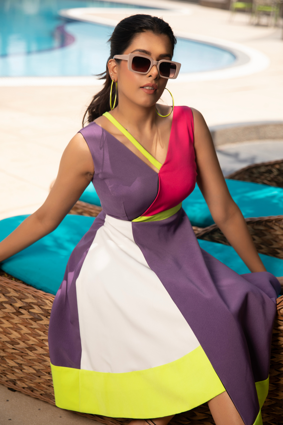A vibrant color blocked dress inspired by sunset hues. Shop Now!