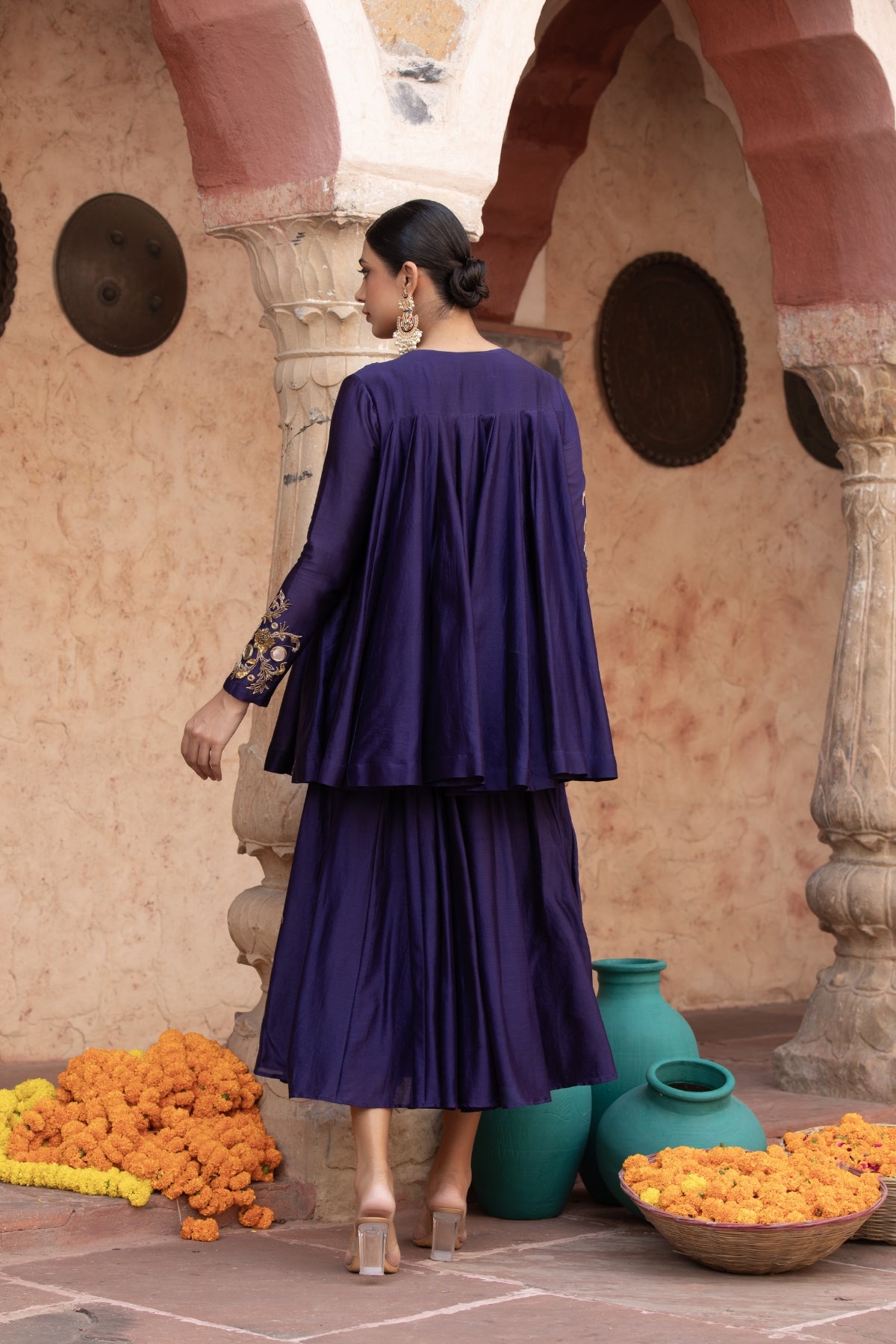Pure Chanderi silk full-sleeve kalidaar tunic with midi lehenga, intricately hand-embellished with zari and mirror work. Shop Now!