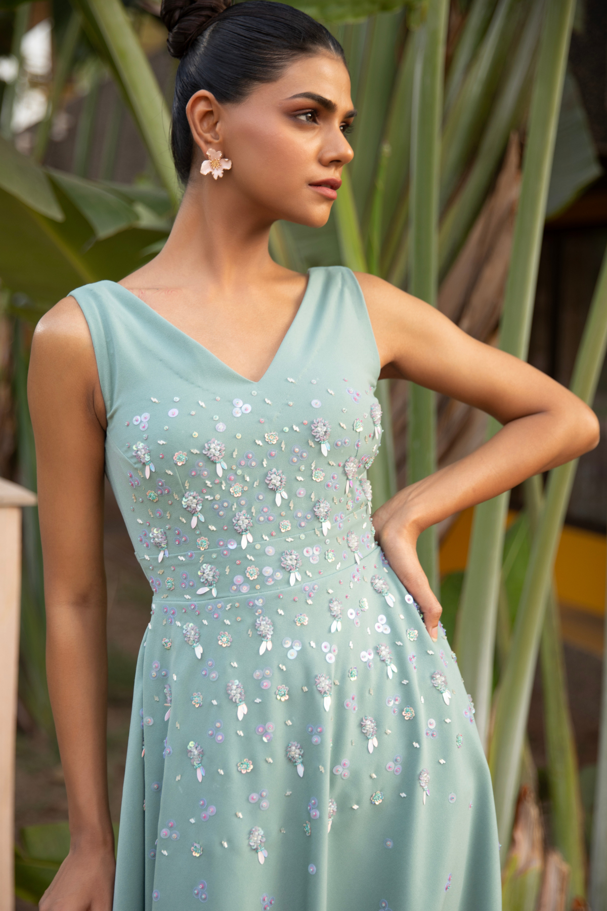 A line sleeveless midi dress in soft mint v neck line paired with fitted bodice tonal floral embroidery Shop Now!
