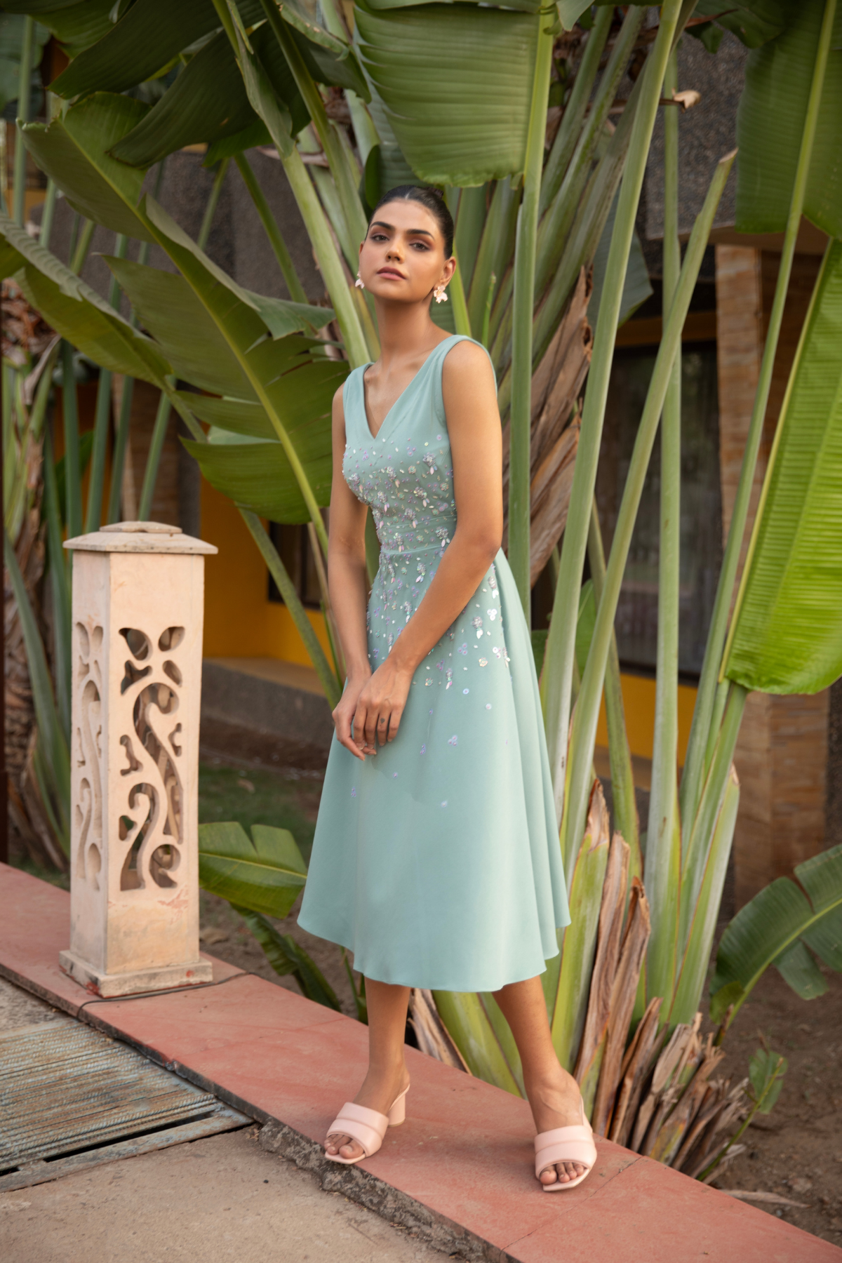 A line sleeveless midi dress in soft mint v neck line paired with fitted bodice tonal floral embroidery Shop Now!