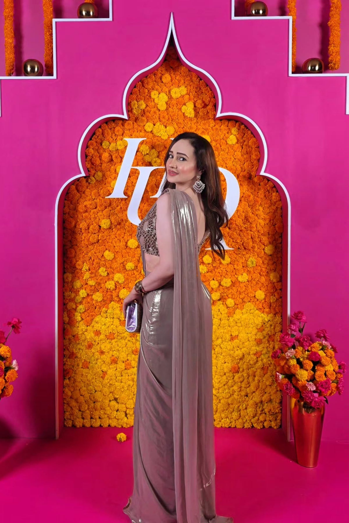 Golden chiffon foil pre-draped saree with an intricately hand-embellished blouse. Shop Now!