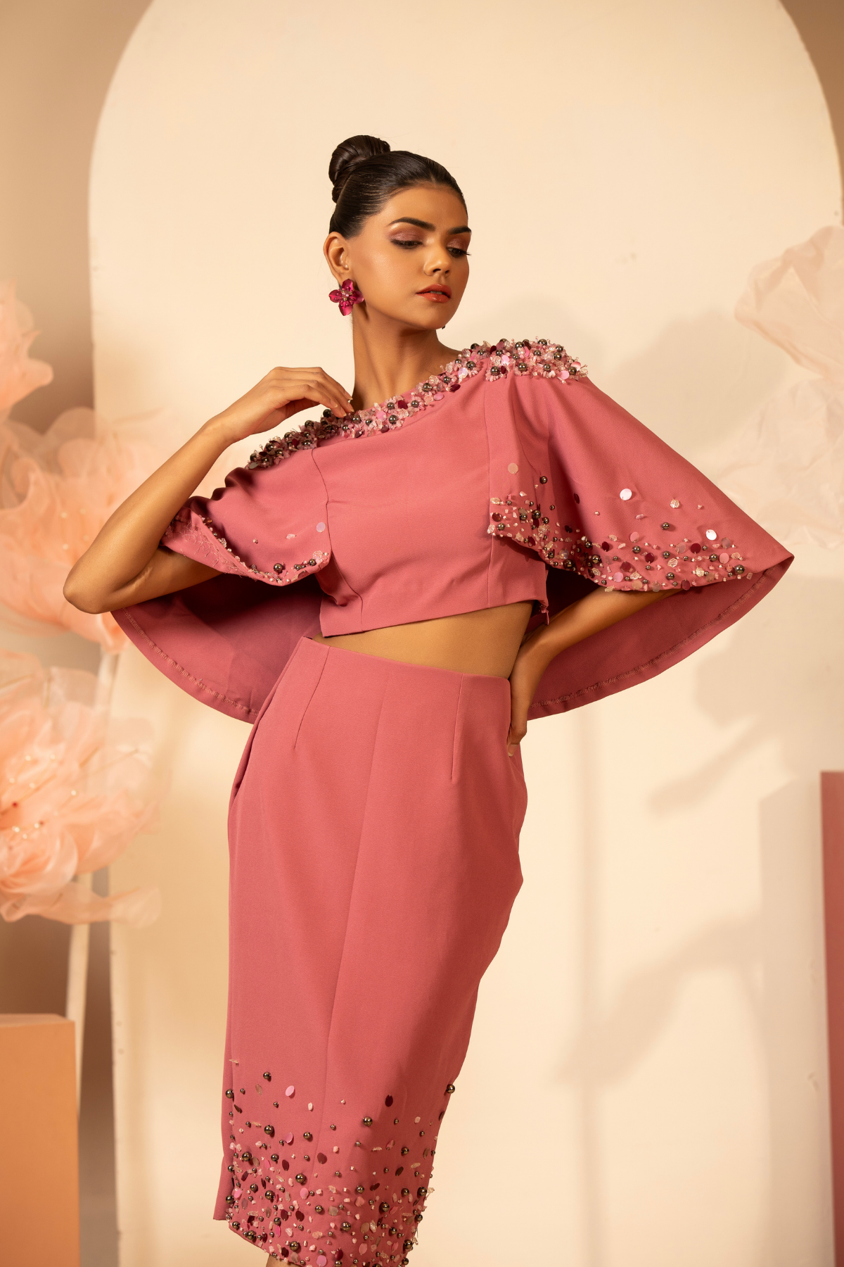 The off  the shoulder dress which delicate three dimentional floral applique and flower motif  with light handed detailing sequins and bead.Fit and flare falls to a mid calf length  Shop Now!