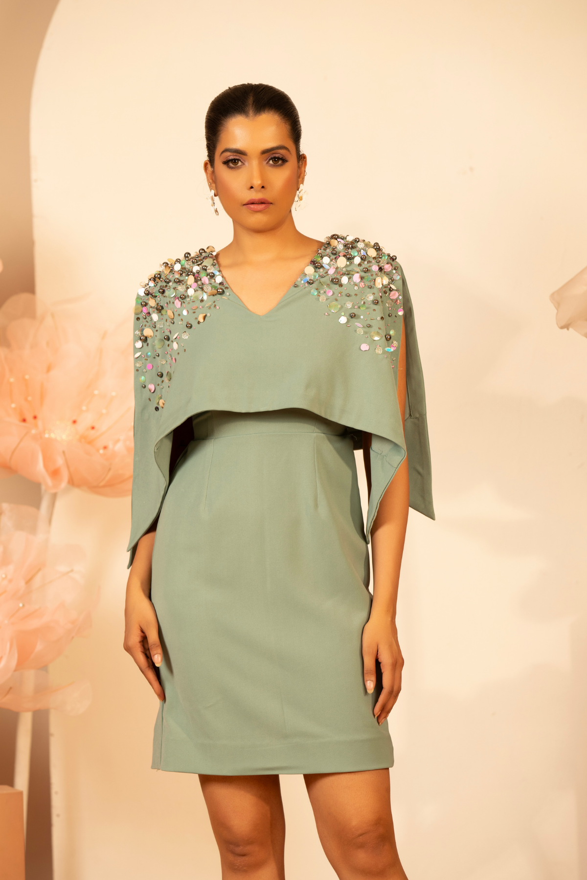 The dress is heavily embellished cape overlay over the shoulder and drape down past the waist wide v neck Shop Now!