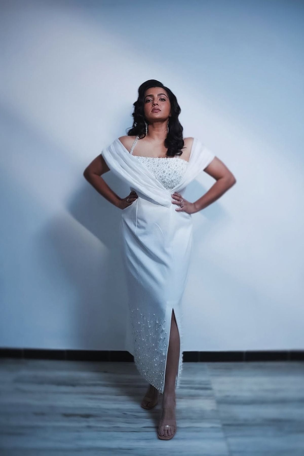 This midi gown that seamlessly balance classic tailoring with experimental  draping with asymmetrical neckline  with intricate embellishments  Shop Now!