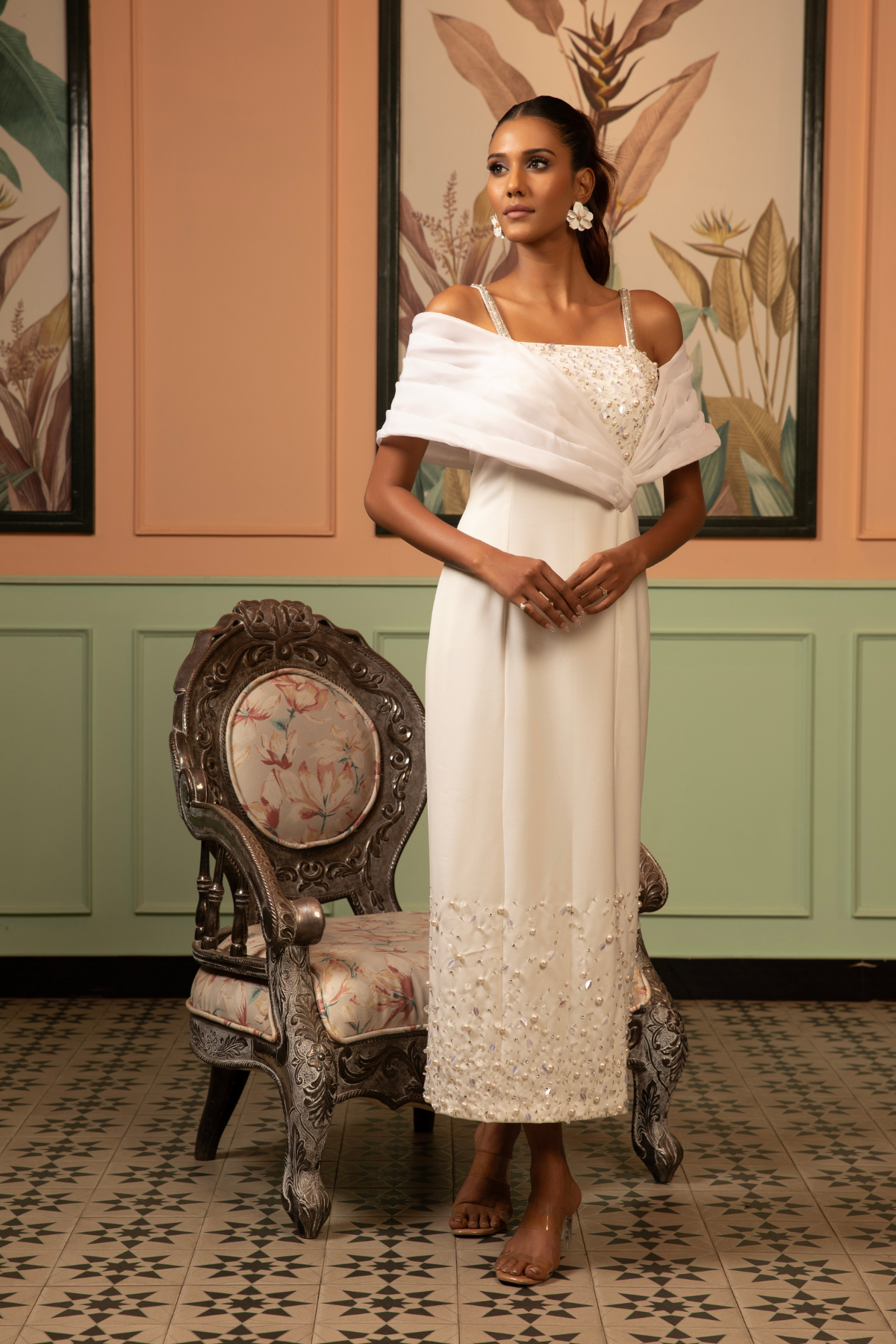 This midi gown that seamlessly balance classic tailoring with experimental  draping with asymmetrical neckline  with intricate embellishments  Shop Now!