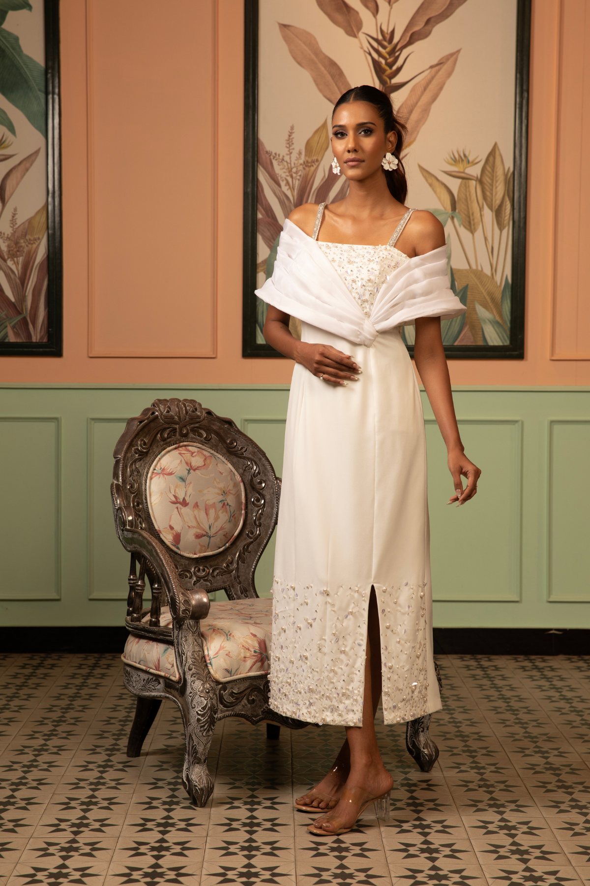 This midi gown that seamlessly balance classic tailoring with experimental  draping with asymmetrical neckline  with intricate embellishments  Shop Now!