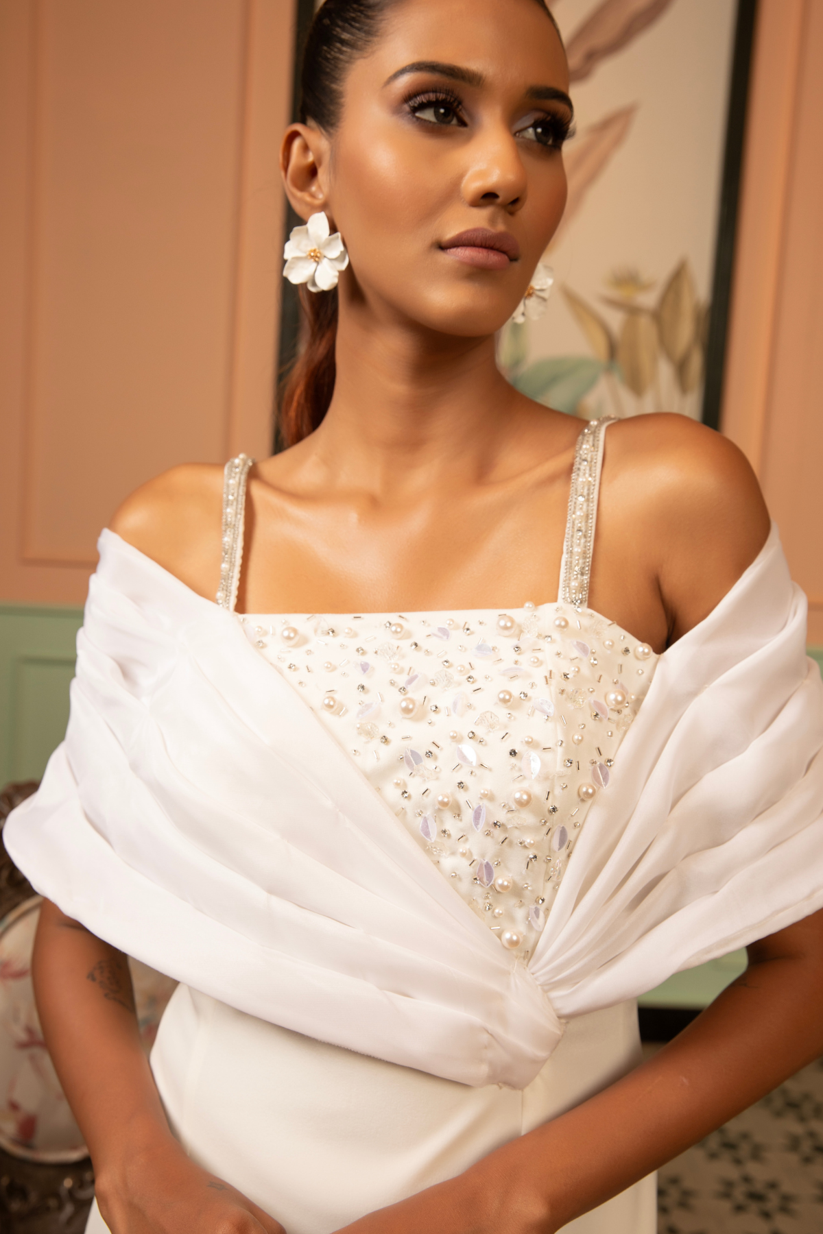 This midi gown that seamlessly balance classic tailoring with experimental  draping with asymmetrical neckline  with intricate embellishments  Shop Now!