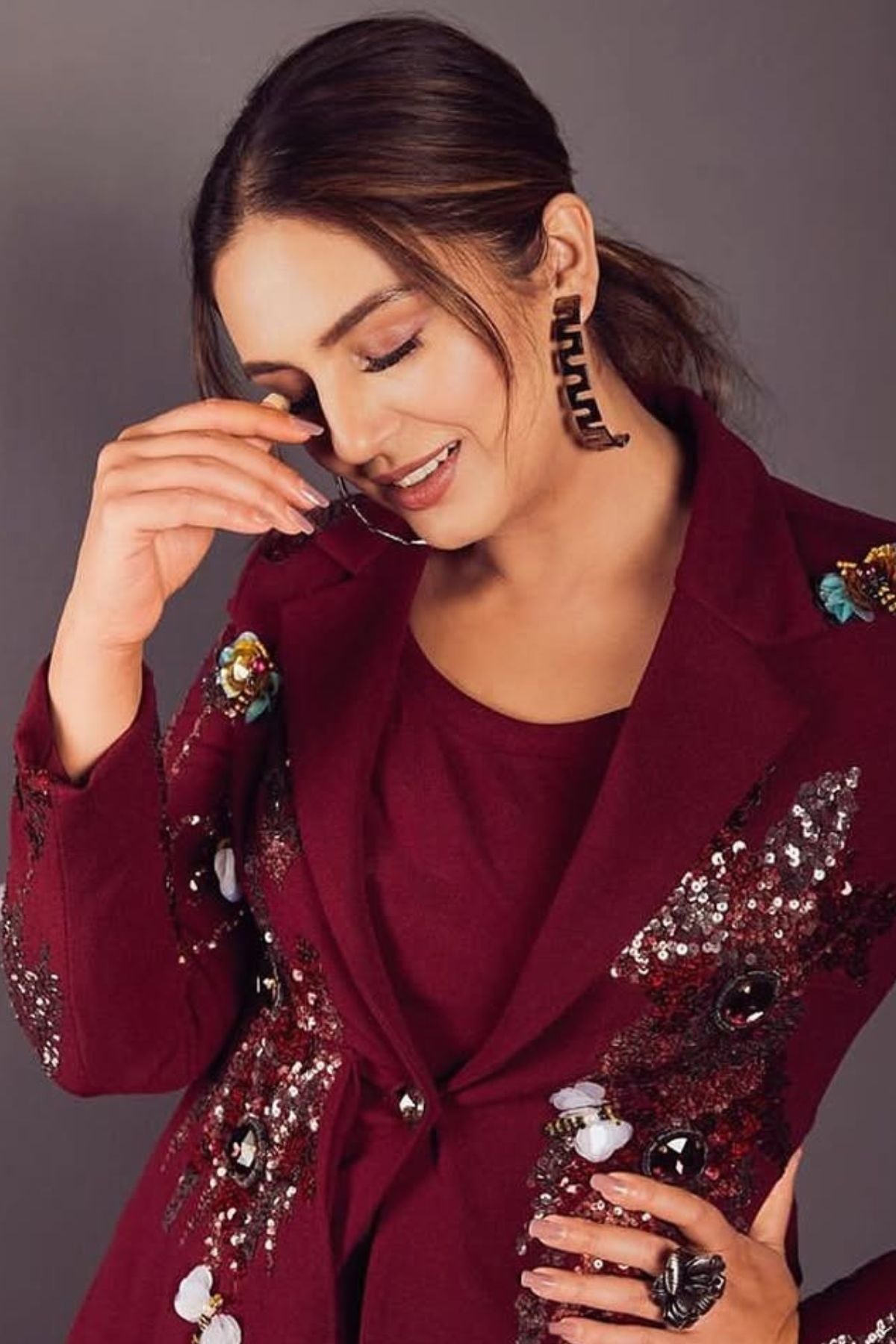 Tailored to sartorial perfection this single-breasted roll collar, peplum style blazer is paired with classic trousers. Its artistic intricate hand-embroidery with a mix of pipes, beads, sequin,cutdana, etc reflects aesthetic craftsmanship . Shop Now!