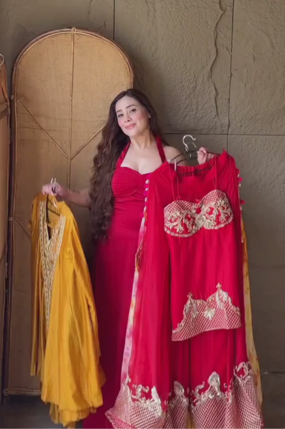 Scarlet red silk corset peplum top with Rococo-inspired hand embellishments, paired with organza palazzo and dupatta featuring zari checks Shop Now!