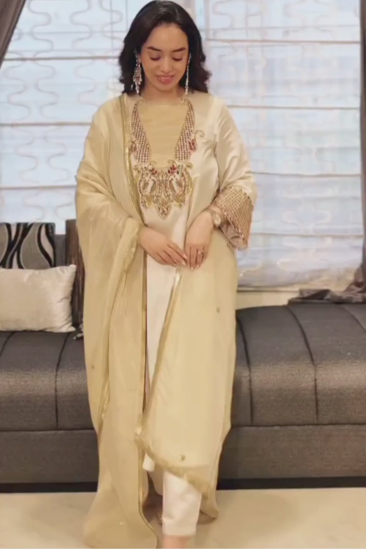 An elegant ivory kurta set crafted in a lustrous fabric, paired with tapered trousers and a fluid dupatta. Features exquisite multicolour handcrafted embroidery with ornate paisley-inspired motifs. A delicately embellished dupatta with gold edging and richly embroidered cuffs completes the look .Shop Now!