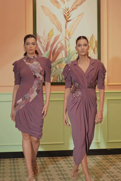This dress is a purple ankle length embellished drape dress with abstract work hand pleating and draping at waist neckline notched lapel collar with adeep v neckline and  structured sleeve  Shop Now!