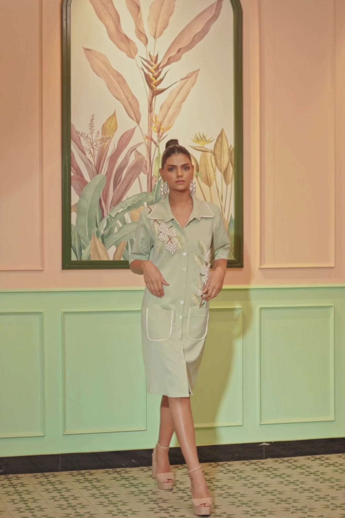The dress is an 3D orchid applique in shade of purple with long green leaves , v neck line with handkerchief cut Shop Now!