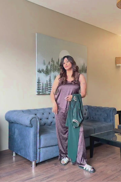Asymmetric gown deep emerald green&nbsp;hue blending morder tailoring with intricate&nbsp;traditional embellishment fitted waist and&nbsp;a fluid draped faux wrap skirt at the midsection. Shop Now!