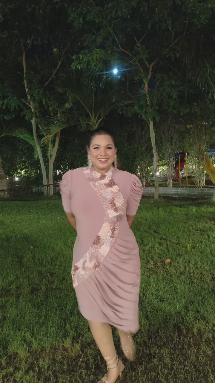 The dress is designed with a flattering&nbsp;form fitting bodycon include soft draping&nbsp;slightly stretchyhigh neck collar and structured&nbsp;puff sleeves shimmering multi tone sequins&nbsp;that flow from neckline to down across. Shop Now!