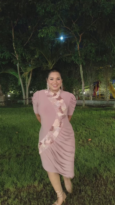 The dress is designed with a flattering&nbsp;form fitting bodycon include soft draping&nbsp;slightly stretchyhigh neck collar and structured&nbsp;puff sleeves shimmering multi tone sequins&nbsp;that flow from neckline to down across. Shop Now!