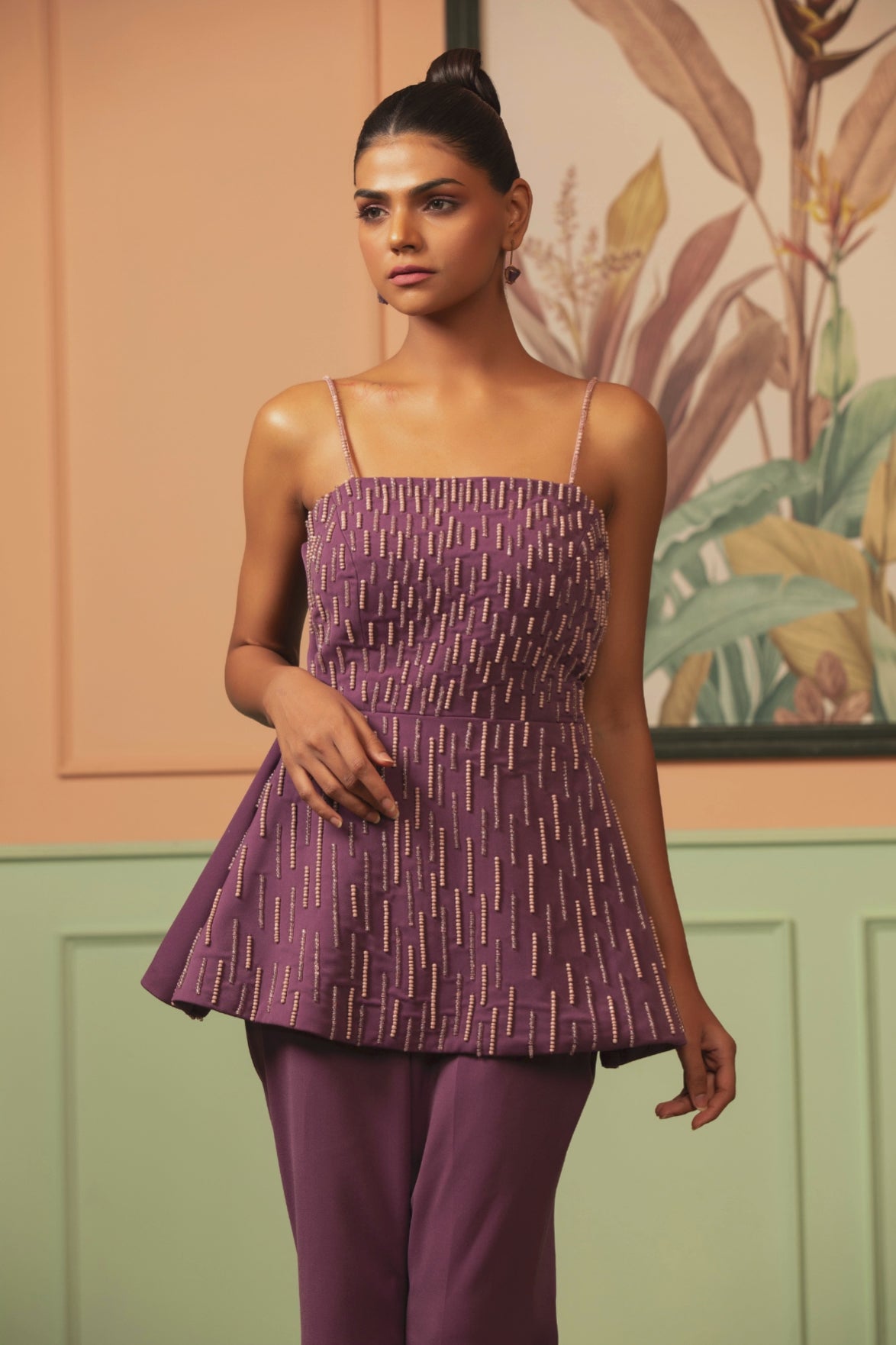 Two piece purple coord set offer a contemporary fusion look strappy neckline structured peplum geometric embroidery paired with matching solid tone wide leg palazzo pant  Shop Now!