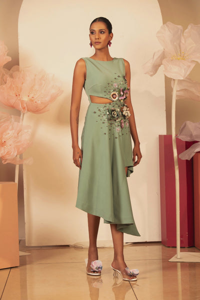 The dress is heavy dimentional embellishments sleeveless and high boat neckline, asymmetric side cutout with 3D floral hand embroidery Shop Now!